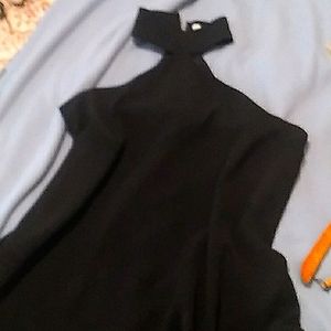 Black sheek evening dress.jaw dropping short dress.made by  do be size L. New